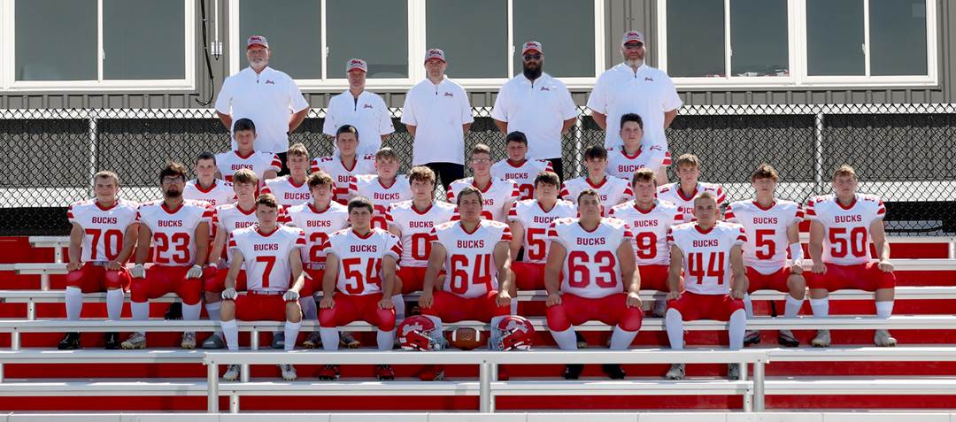 A football team posing for a photo

Description automatically generated