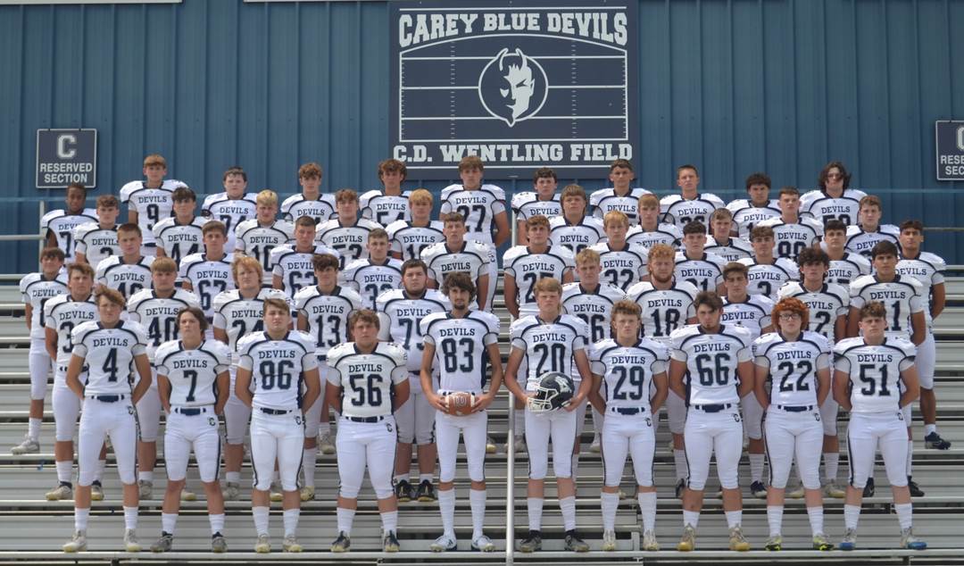 A group of football players posing for a photo

Description automatically generated