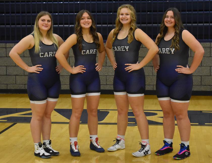 A group of girls in wrestling uniforms

Description automatically generated