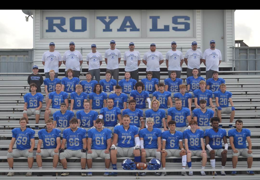 A group of football players posing for a photo

Description automatically generated